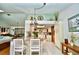 Open-concept living area features a kitchen and dining space for easy entertaining at 75 Knollwood Estates Dr, Ormond Beach, FL 32174