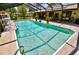 Large screened in outdoor pool is perfect for relaxing or entertaining guests at 75 Knollwood Estates Dr, Ormond Beach, FL 32174
