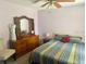 Bright bedroom with a vanity dresser, and a comfortable bed at 2612 Umbrella Tree Dr, Edgewater, FL 32141