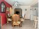 Dining room with a wooden table set and tile floors at 2612 Umbrella Tree Dr, Edgewater, FL 32141