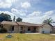 Charming single story home with a well maintained lawn and a one car garage at 2612 Umbrella Tree Dr, Edgewater, FL 32141