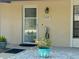 Charming front porch featuring decorative touches and a welcoming entrance at 2612 Umbrella Tree Dr, Edgewater, FL 32141