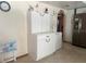 Kitchen with stainless steel appliances, tiled floors, and ample cabinet space at 2612 Umbrella Tree Dr, Edgewater, FL 32141