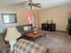 Comfortable living room featuring carpeted floors and a cozy seating area at 2612 Umbrella Tree Dr, Edgewater, FL 32141