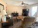 Relaxing living room with plush seating, ceiling fan, and neutral toned walls at 2612 Umbrella Tree Dr, Edgewater, FL 32141