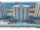 Elegant oceanfront condo building with a pool, sundeck, and private beach access at 2967 S Atlantic Ave # 708, Daytona Beach Shores, FL 32118