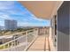 Balcony with ocean view and city view, featuring white railings and sliding glass door at 2967 S Atlantic Ave # 708, Daytona Beach Shores, FL 32118