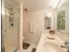 Bathroom featuring a step-in shower, ample lighting, and dual sinks at 2967 S Atlantic Ave # 708, Daytona Beach Shores, FL 32118