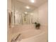 Bathroom featuring a soaking tub, and large mirror at 2967 S Atlantic Ave # 708, Daytona Beach Shores, FL 32118