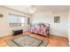This bedroom offers natural light, warm wood floors, and a comfortable seating area at 2967 S Atlantic Ave # 708, Daytona Beach Shores, FL 32118