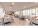 Bright dining area with multiple tables and large windows offering views at 2967 S Atlantic Ave # 708, Daytona Beach Shores, FL 32118