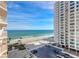 Exterior view of a beachfront condo building with a parking lot, beach access, and ocean views at 2967 S Atlantic Ave # 708, Daytona Beach Shores, FL 32118