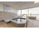 Inviting indoor hot tub area with scenic views and a relaxing ambiance at 2967 S Atlantic Ave # 708, Daytona Beach Shores, FL 32118