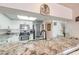 Well-equipped kitchen featuring granite counters, stainless appliances, and white cabinetry at 2967 S Atlantic Ave # 708, Daytona Beach Shores, FL 32118