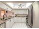 Bright kitchen with stainless steel appliances, granite counters, and white cabinets at 2967 S Atlantic Ave # 708, Daytona Beach Shores, FL 32118