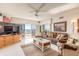 Cozy living room with a large sectional sofa, area rug, and floor-to-ceiling windows at 2967 S Atlantic Ave # 708, Daytona Beach Shores, FL 32118