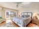 Cozy bedroom features a king bed, natural light, and access to a balcony with city views at 2967 S Atlantic Ave # 708, Daytona Beach Shores, FL 32118