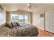 Bright main bedroom featuring hardwood floors, balcony access, and ample closet space at 2967 S Atlantic Ave # 708, Daytona Beach Shores, FL 32118