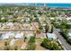 An aerial view of a property, showing it's proximity to local amenities, beaches, and the surrounding neighborhood at 394 Golf Blvd, Daytona Beach, FL 32118