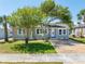 Charming single-story home featuring a well-maintained lawn and inviting curb appeal with shade trees at 394 Golf Blvd, Daytona Beach, FL 32118