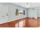 Bright living room featuring gleaming hardwood floors and natural light, creating an inviting and cozy atmosphere at 394 Golf Blvd, Daytona Beach, FL 32118