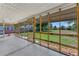 Spacious screened-in patio with a view of the backyard, perfect for relaxing and enjoying the outdoors at 394 Golf Blvd, Daytona Beach, FL 32118