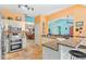 Modern kitchen featuring stainless steel appliances, granite countertops, and a convenient breakfast bar open to other living areas at 4008 Acoma Dr, Ormond Beach, FL 32174
