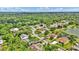 Aerial view showcasing the community, with homes, green spaces, and a serene lake at 518 Moon Rise Dr, Port Orange, FL 32127