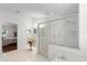 En-suite bathroom with walk-in shower, vanity, and tile flooring at 518 Moon Rise Dr, Port Orange, FL 32127