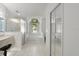 Bright bathroom featuring a walk-in shower, tub, and mirrored closet doors at 518 Moon Rise Dr, Port Orange, FL 32127