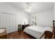 Comfortable bedroom featuring hardwood floors, window, and neutral decor at 518 Moon Rise Dr, Port Orange, FL 32127