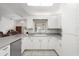Spacious kitchen featuring lots of cabinet space and a view of the living area at 518 Moon Rise Dr, Port Orange, FL 32127