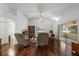 Bright living room with wood floors, high ceilings, ceiling fan and sliding doors leading to a lanai at 518 Moon Rise Dr, Port Orange, FL 32127