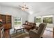 Bright living room featuring hardwood floors and sliding glass doors with a lovely view at 518 Moon Rise Dr, Port Orange, FL 32127