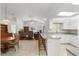 Open floor plan with views from the kitchen to the living room with hardwood floors at 518 Moon Rise Dr, Port Orange, FL 32127