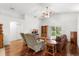 Open living room features hardwood floors with easy access to an outdoor patio at 518 Moon Rise Dr, Port Orange, FL 32127