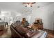 Open living room featuring vaulted ceilings, hardwood floors, and comfortable seating at 518 Moon Rise Dr, Port Orange, FL 32127