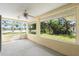 Screened patio offering tranquil view of the lake and backyard at 518 Moon Rise Dr, Port Orange, FL 32127