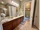Spacious bathroom with double vanity, tile flooring, and separate toilet room at 745 Aldenham Ln, Ormond Beach, FL 32174