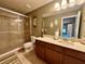 Well-lit bathroom featuring a glass shower, spacious vanity, and tasteful decor at 745 Aldenham Ln, Ormond Beach, FL 32174