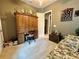 This is a bedroom with hardwood furniture, and a ceiling fan at 745 Aldenham Ln, Ormond Beach, FL 32174