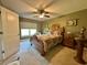 Charming bedroom with wood furnishings, a window view, and ample natural light at 745 Aldenham Ln, Ormond Beach, FL 32174