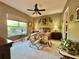A tranquil bedroom with comfortable furnishings and a ceiling fan at 745 Aldenham Ln, Ormond Beach, FL 32174