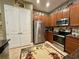 Modern kitchen with stainless steel appliances, ample cabinet space, and a large refrigerator at 745 Aldenham Ln, Ormond Beach, FL 32174