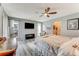 Light-filled bedroom with modern floors, ceiling fan, and large windows, creating a comfortable retreat at 11 Larisa Ter, Ormond Beach, FL 32174