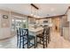 Bright eat-in kitchen featuring a marble island with seating and modern stainless-steel appliances at 11 Larisa Ter, Ormond Beach, FL 32174