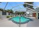 Enclosed pool area offers privacy and shade with lush landscaping and comfortable lounging at 11 Larisa Ter, Ormond Beach, FL 32174