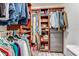 Well-organized walk-in closet with built-in shelving, hanging rods, and convenient storage drawers at 11 Larisa Ter, Ormond Beach, FL 32174