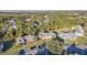 The aerial view displays a well-manicured property with convenient parking, and lush greenery, and mature trees at 133 Blue Heron Dr # C, Daytona Beach, FL 32119