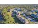 A view of a quiet community street with well-maintained lawns and lush trees surrounding various homes at 133 Blue Heron Dr # C, Daytona Beach, FL 32119